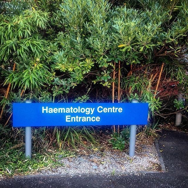 A blue NHS sign displaying Heamatology Centre Entrance